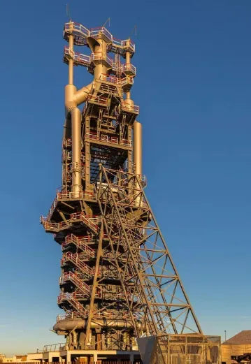 Tower structure at the steel plant, seen against the evening sky