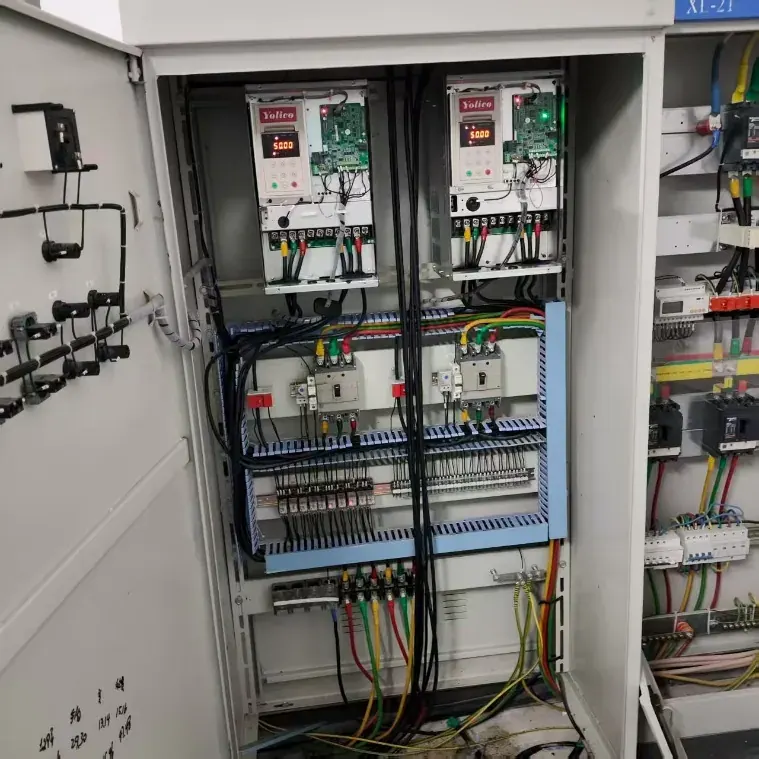 Two YD580 drives in the pump control cabinet, with their terminations below